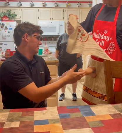 Holiday Grill Master red apron showing hidden surprise pocket and approximate dimensions