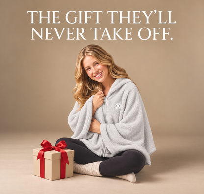Woman wearing a grey Cozy Babe heated fleece wrap beside a gift box